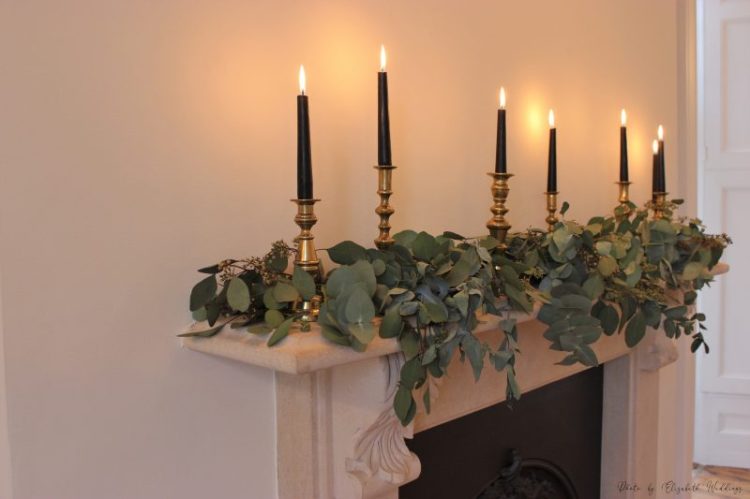 Black, gold brass candlesticks and foliage, by Elizabeth Weddings